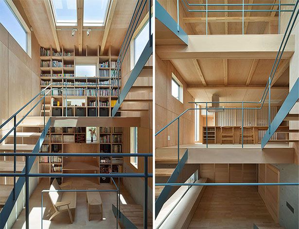 Cầu thang với kệ sách cao chạm trần và các tầng lầu xếp lớp Ảnh © Yousuke Harigane