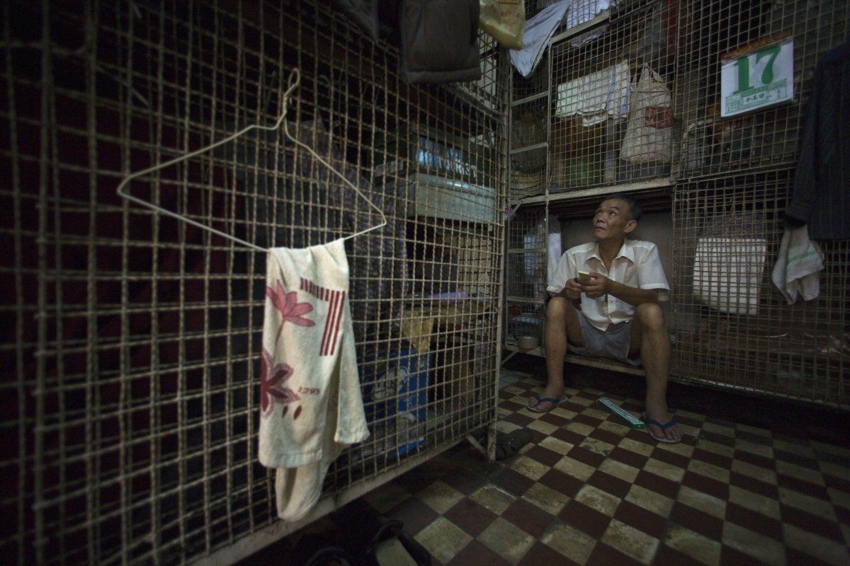 hundreds of elderly men such as kong siu kau live in these conditions in one such building up to 12 men can live together in tightly packed cages