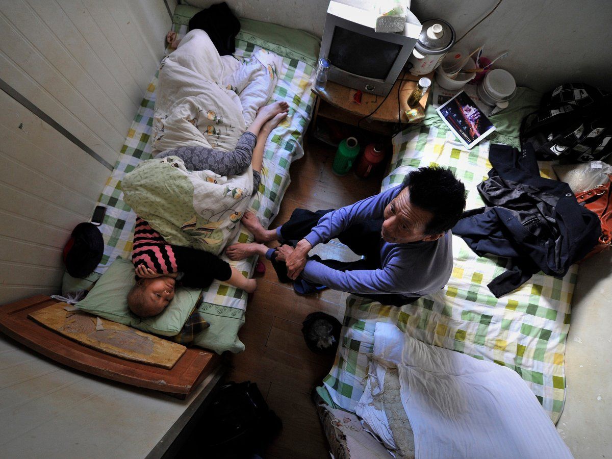 in the chinese city of hefei patients who cant afford a bed at the local hospital are forced to receive treatment in one of the 86 square foot rooms in a nearby apartment building