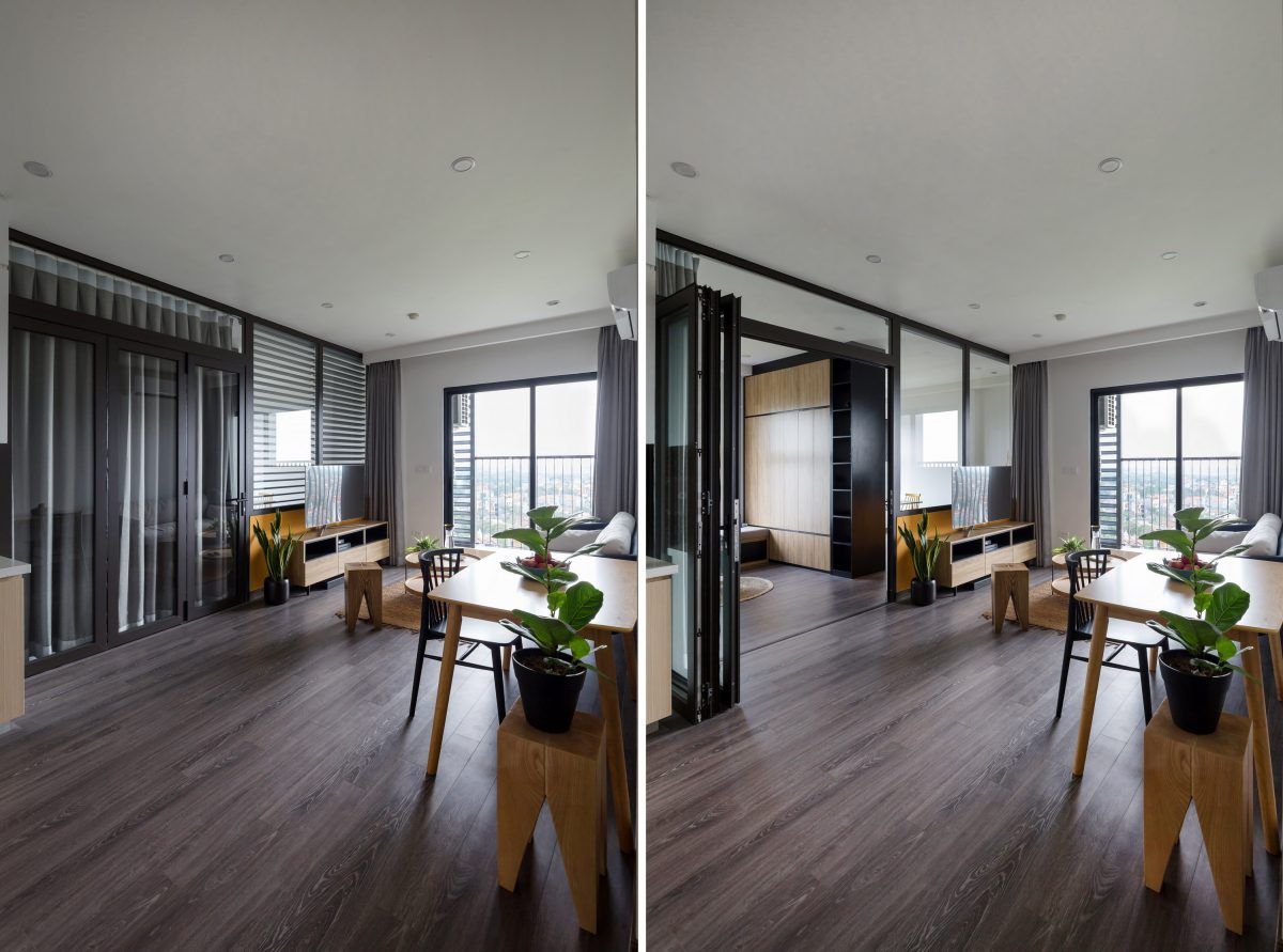 Vách kính phân chia không gian giữa phòng khách và khu phòng làm việc.